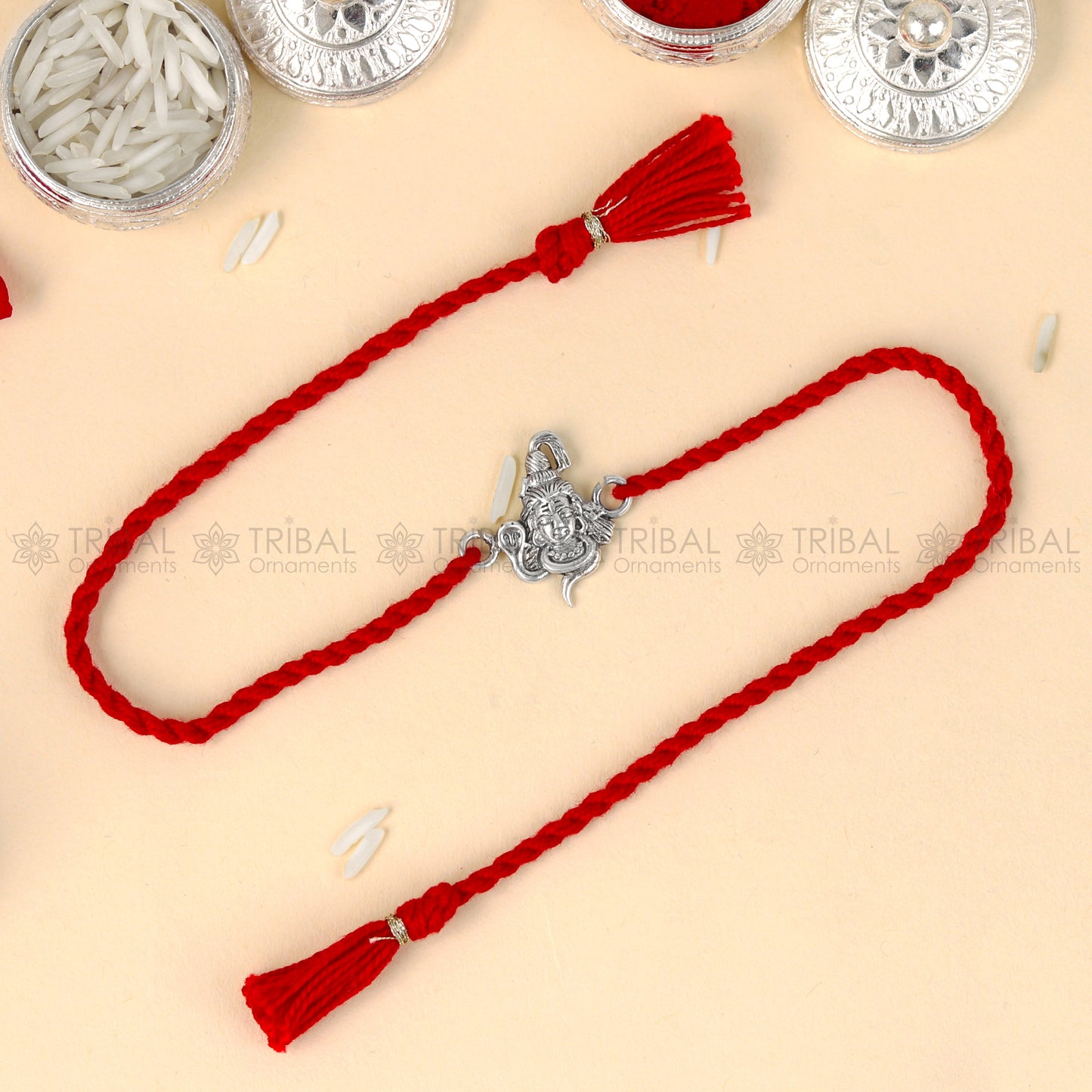 925 Sterling silver Lord Shiva design thread bracelet with red thread and Mahadeva pendant from TRIBAL ORNAMENTS.