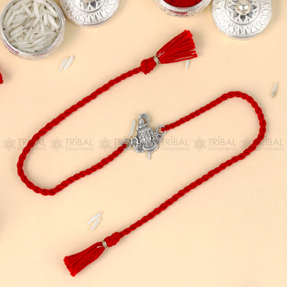 925 Sterling silver Lord Shiva design thread bracelet with red thread and Mahadeva pendant from TRIBAL ORNAMENTS.