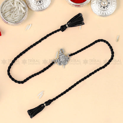 925 Sterling silver Lord Shiva design thread bracelet with red thread and Mahadeva pendant from TRIBAL ORNAMENTS.