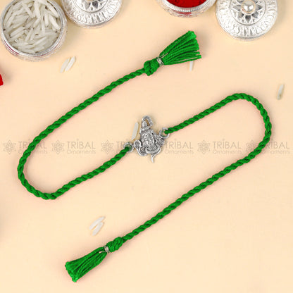 Sterling silver Lord Shiva design thread bracelet by TRIBAL ORNAMENTS with red thread and Mahadeva pendant.