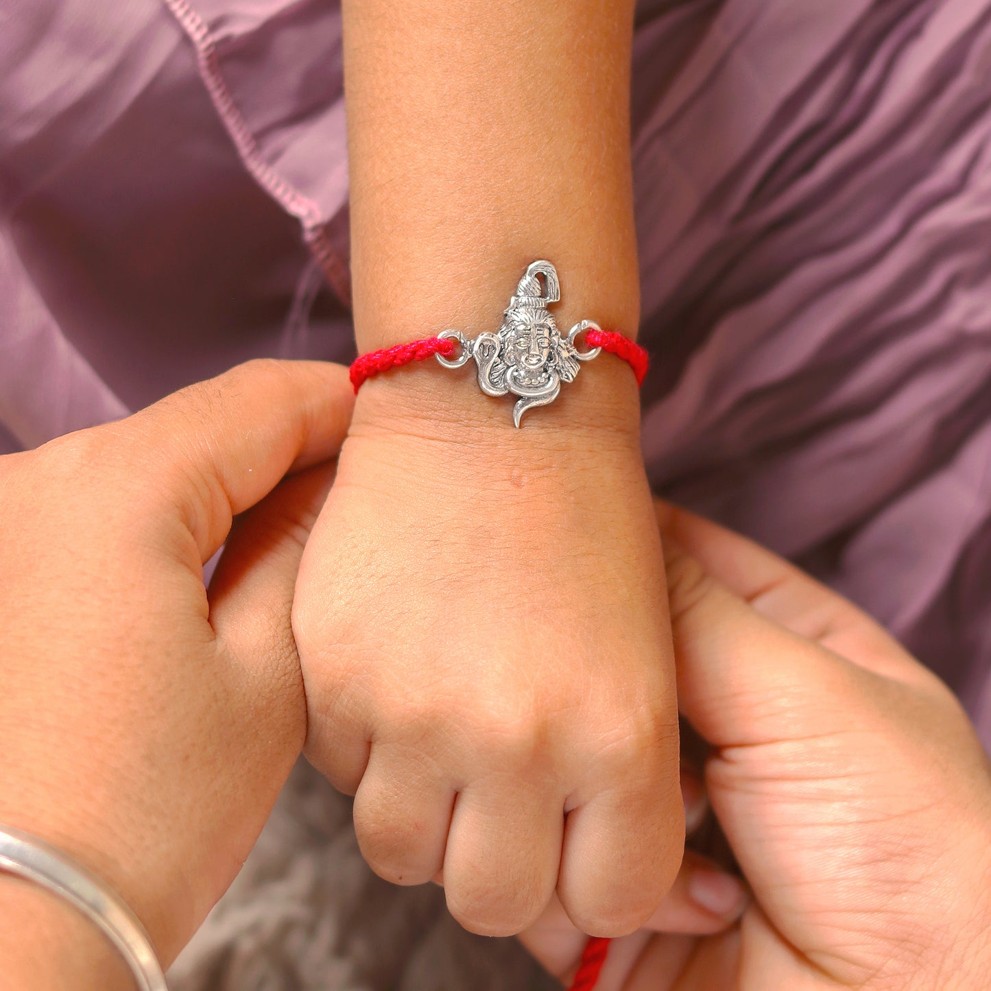 925 Sterling silver Lord Shiva design thread bracelet with red thread and Mahadeva pendant by Tribal Ornaments.