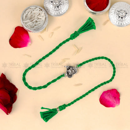 925 Sterling silver Lord Ganesha bracelet with red thread and pan design pendant, tribal ornament style.