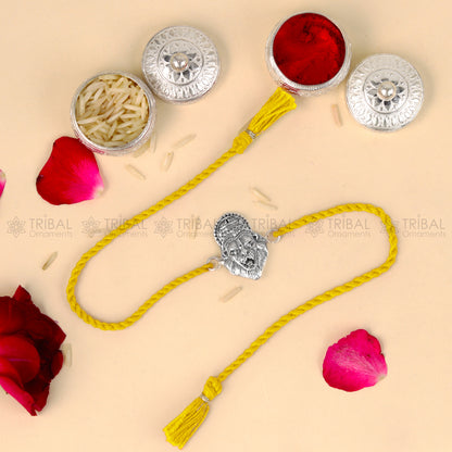 925 Sterling silver Narsimha design thread bracelet with red thread by TRIBAL ORNAMENTS featuring a detailed pendant.
