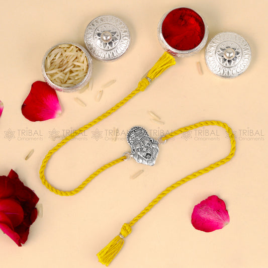 925 Sterling silver Narsimha design thread bracelet with red thread by TRIBAL ORNAMENTS featuring a detailed pendant.