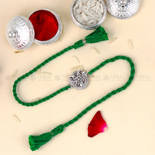 Sterling silver Nazar Battu design thread bracelet with red thread from TRIBAL ORNAMENTS, featuring a traditional pendant.