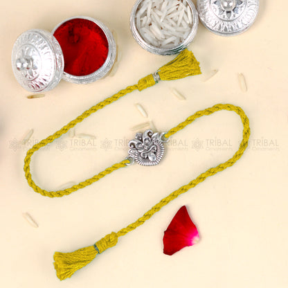 925 Sterling silver rakhi bracelet with red thread and Nazar Battu pendant, tribal ornaments design.