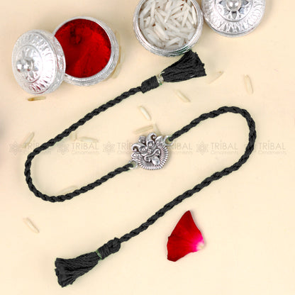 925 Sterling silver rakhi bracelet with a red thread and Nazar Battu design pendant by TRIBAL ORNAMENTS
