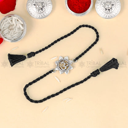 925 Sterling silver om design thread bracelet with red thread and pendant, crafted by TRIBAL ORNAMENTS.