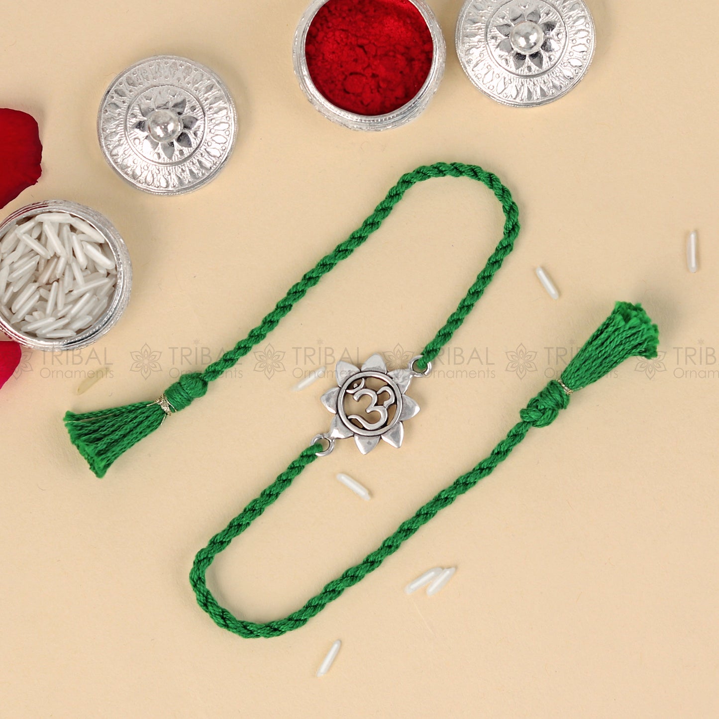 925 sterling silver Om design thread rakhi bracelet with red thread, featuring a silver Om pendant for Rakshabandhan festival.