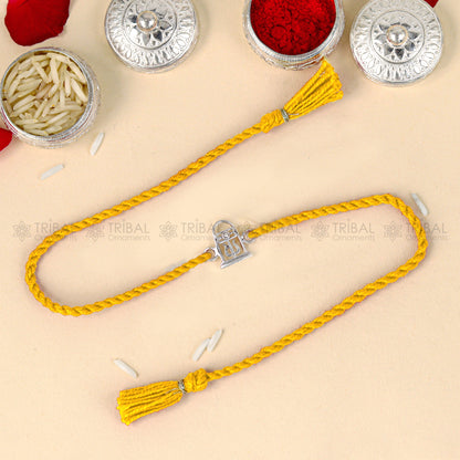 Sterling silver Siva lingam design thread bracelet with red thread, handcrafted by TRIBAL ORNAMENTS.