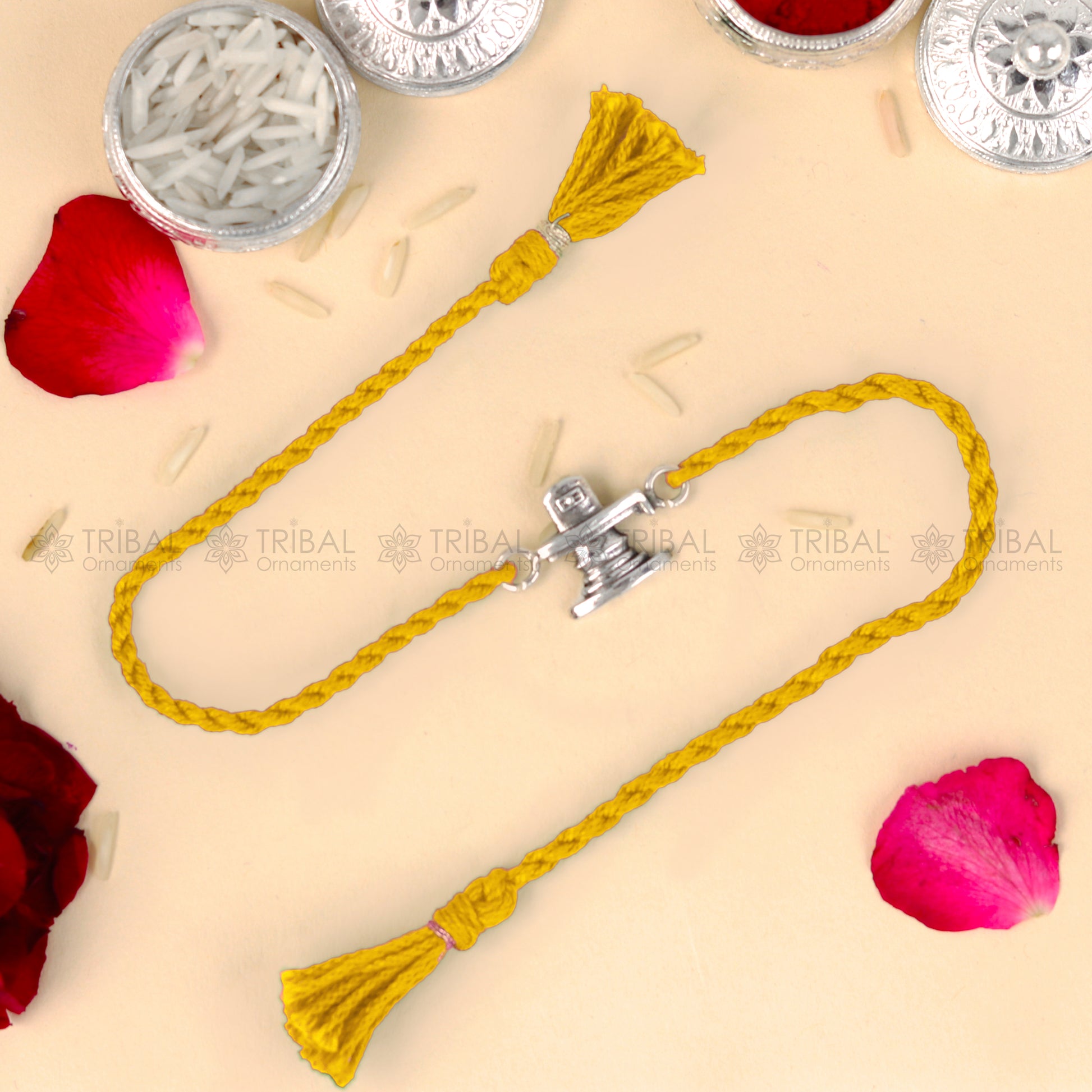 925 Sterling silver Siva lingam design thread bracelet with red thread from TRIBAL ORNAMENTS, showcasing intricate pendant details.