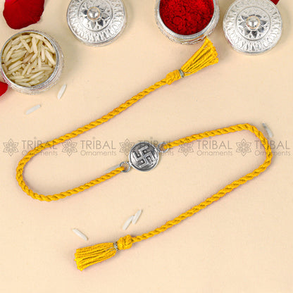 925 Sterling silver Swashtik design thread rakhi bracelet with red thread and pendant from TRIBAL ORNAMENTS.