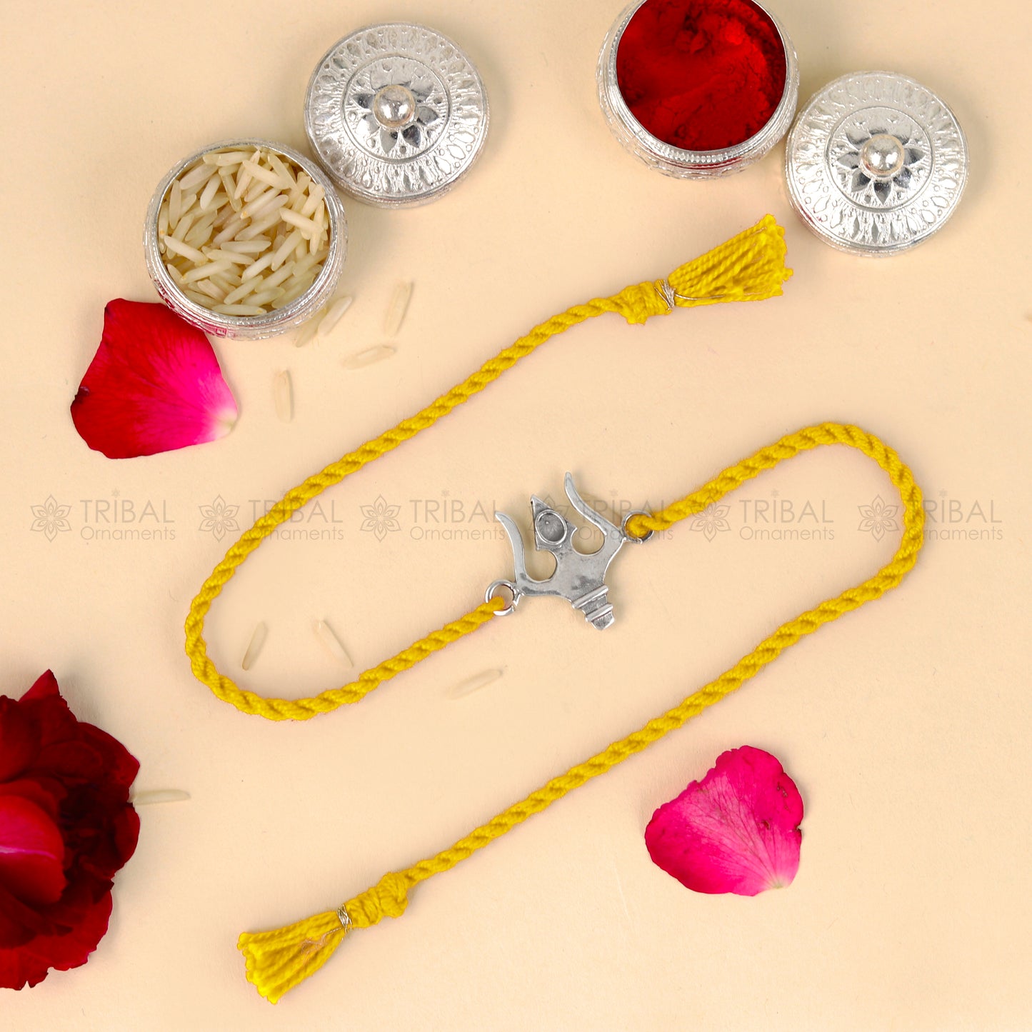 Sterling silver Trishul bracelet with red thread from Tribal Ornaments, featuring a traditional trident pendant for Rakshabandhan.