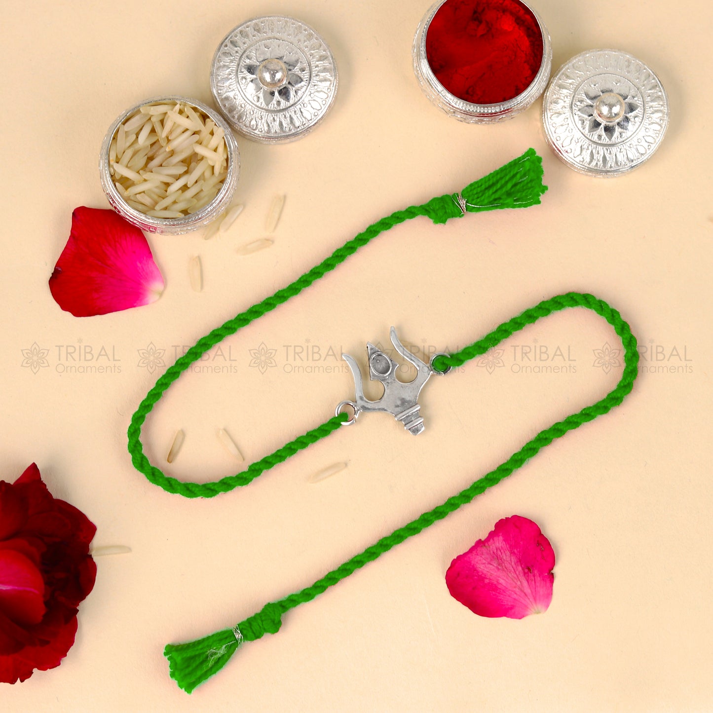 Sterling silver Trishul bracelet with red thread and trident pendant from TRIBAL ORNAMENTS, ideal for Rakshabandhan festival.