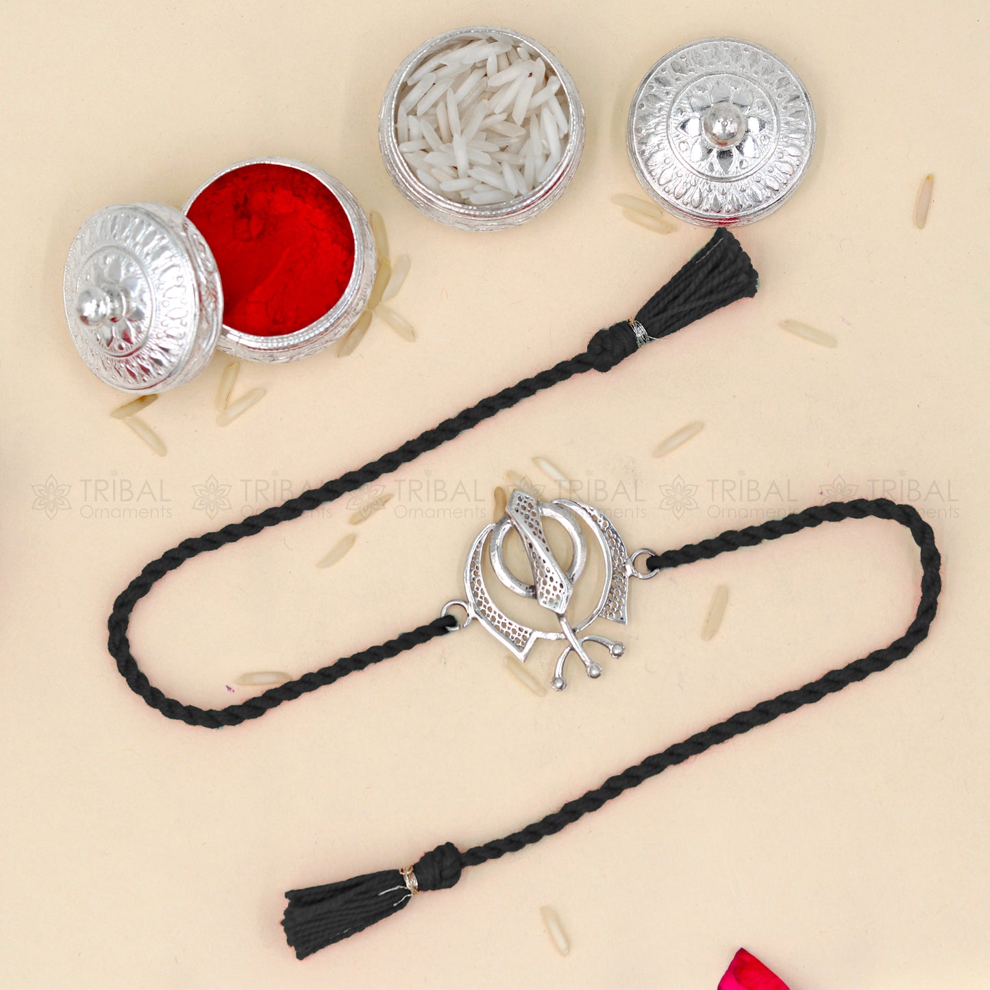 925 Sterling silver Khalsa design thread rakhi bracelet with red thread and Wahe Guru Ji pendant from TRIBAL ORNAMENTS.