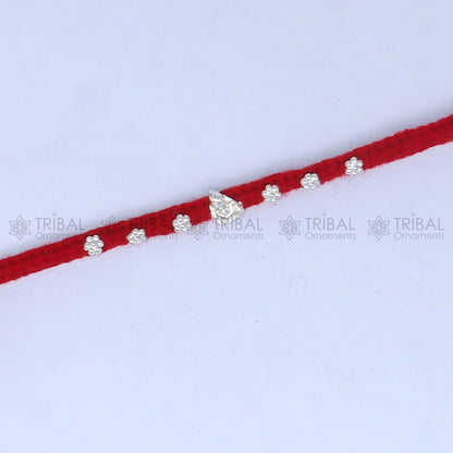 925 sterling silver Lord Ganesha thread rakhi bracelet by TRIBAL ORNAMENTS featuring Ganesha pendant for Raksha Bandhan festival.