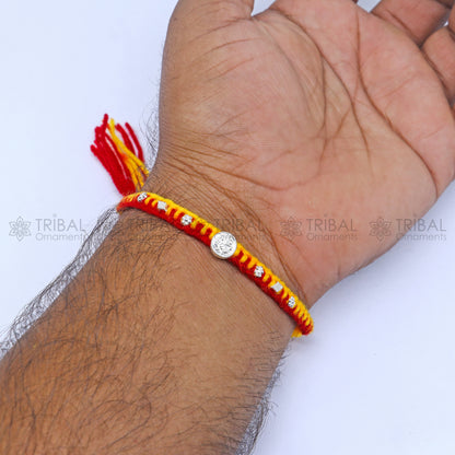 Sterling silver Lord Ganesha design thread rakhi bracelet with intricate pendant from Tribal Ornaments, ideal for Rakshabandhan.