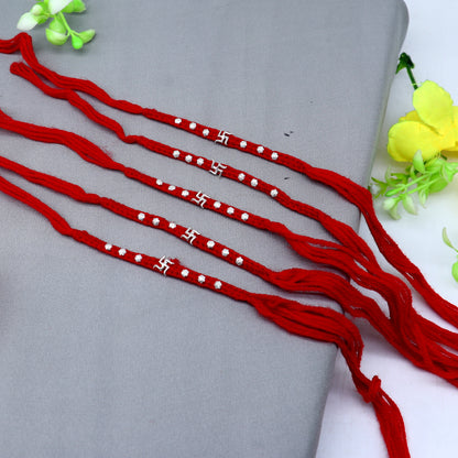 Sterling silver Swashtik design thread rakhi bracelet by TRIBAL ORNAMENTS with intricate pendant for Rakshabandhan festival.