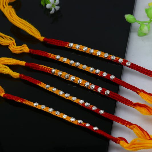 925 Sterling silver thread rakhi bracelet with unique design and pendant, ideal for Rakshabandhan festival by TRIBAL ORNAMENTS.