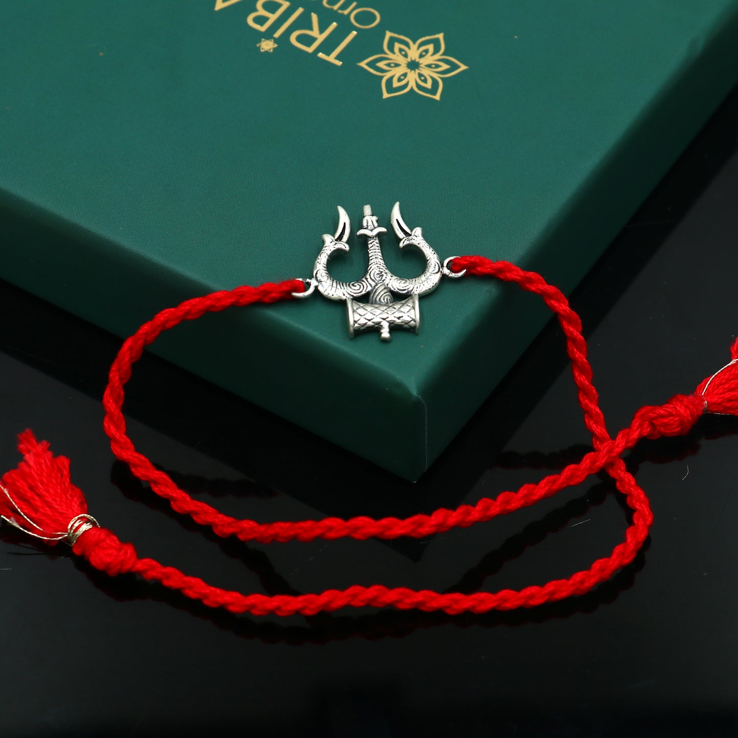 Sterling silver Trishul thread rakhi bracelet with Trident design by Tribal Ornaments, perfect for Rakshabandhan festival.