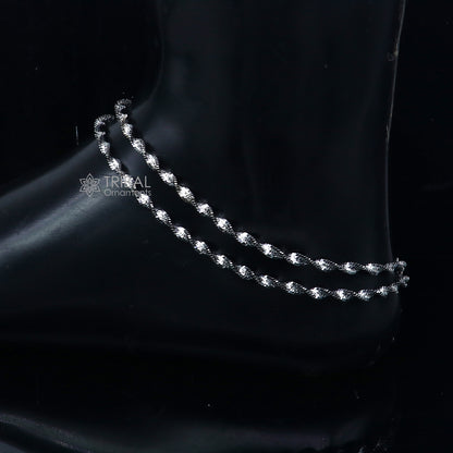 Sterling silver twisting chain anklet bracelet by Tribal Ornaments, lightweight and stylish ankle jewelry with intricate design.