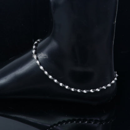 Sterling silver twisting chain anklet bracelet by Tribal Ornaments, lightweight ankle jewelry with intricate design.