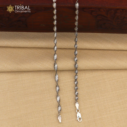 Sterling silver twisting chain anklet bracelet from TRIBAL ORNAMENTS, lightweight ankle jewelry with intricate design and secure clasp
