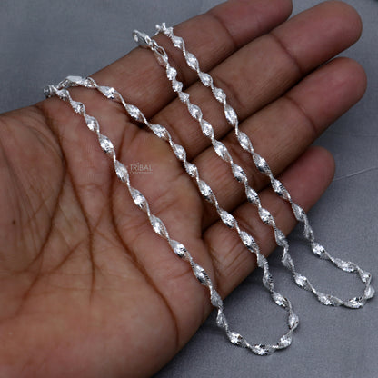 Sterling silver twisting chain anklet bracelet by Tribal Ornaments, lightweight ankle jewelry with intricate design, 10.5 inches long.