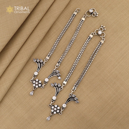 Sterling silver 10.5-inch ankle bracelet with a unique design and white stone accents, featuring intricate tribal jewelry style.