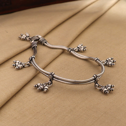 Sterling silver vintage snake chain ankle bracelet with hanging bells, tribal ornaments style, 10.5 inches long.