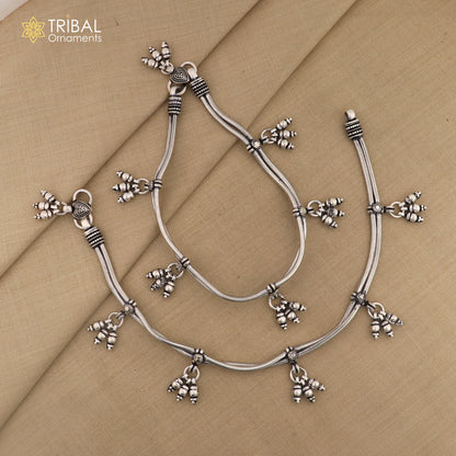 Sterling silver vintage-style snake chain ankle bracelet with hanging bells, crafted by TRIBAL ORNAMENTS.