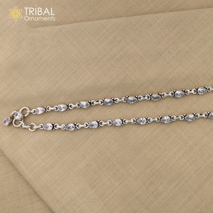 Sterling silver anklet with white stone accents, tribal ornament design, 10.5-inch foot bracelet for stylish ankle jewelry.