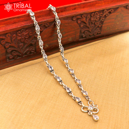 Sterling silver anklet with white stone detail, 10.5-inch foot bracelet by TRIBAL ORNAMENTS with intricate design.