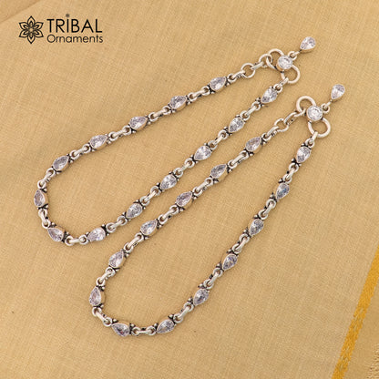 Sterling silver 10.5-inch ankle bracelet with white stone accents, featuring tribal ornament design for stylish foot jewelry.