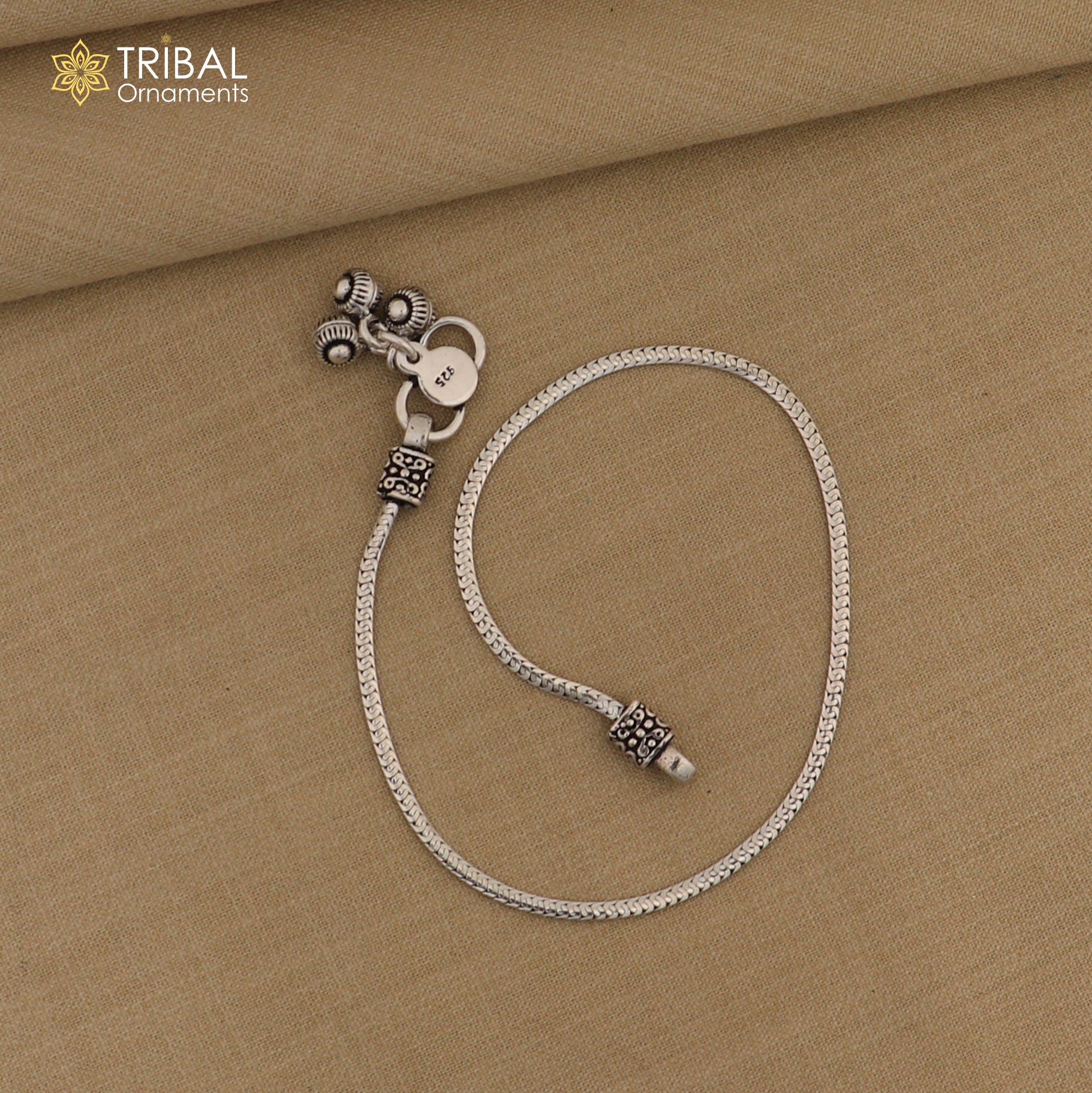 Lightweight 10.5-inch sterling silver chain anklet by TRIBAL ORNAMENTS, stylish foot jewelry with intricate link design.