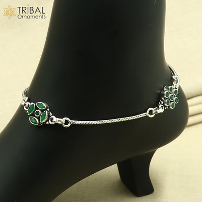 Sterling silver green stone chain anklet from Tribal Ornaments, featuring a delicate foot bracelet with intricate design and green gemstone accents.
