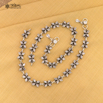 Sterling silver anklet with white stone flower design, Tribal Ornaments 10-inch foot bracelet featuring intricate floral details.