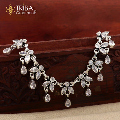 Sterling silver 10-inch flower design anklet with white stones from TRIBAL ORNAMENTS, featuring intricate floral jewelry details.