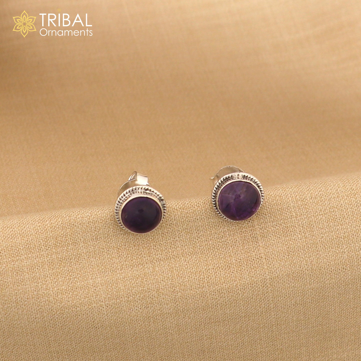 Sterling silver 11mm round amethyst stud earrings by TRIBAL ORNAMENTS, unisex jewelry with vibrant purple gemstones.