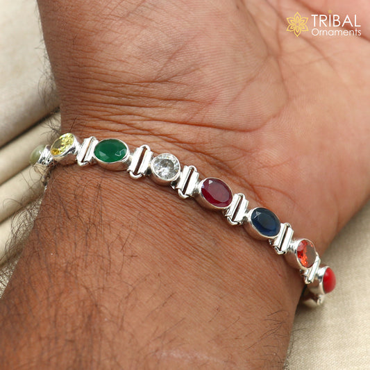 Sterling silver Navratan stone unisex bracelet featuring colorful stones and intricate design, handcrafted jewelry by Tribal Ornaments.