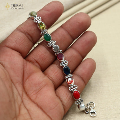 Sterling silver Navratan stone unisex bracelet featuring colorful stones and intricate design, handcrafted by Tribal Ornaments.