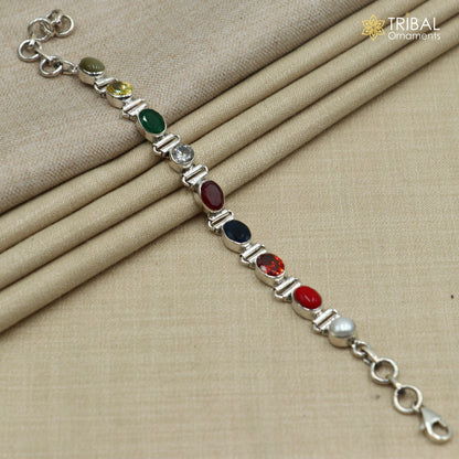 Sterling silver Navratan stone unisex bracelet featuring colorful gemstones, handcrafted by Tribal Ornaments.