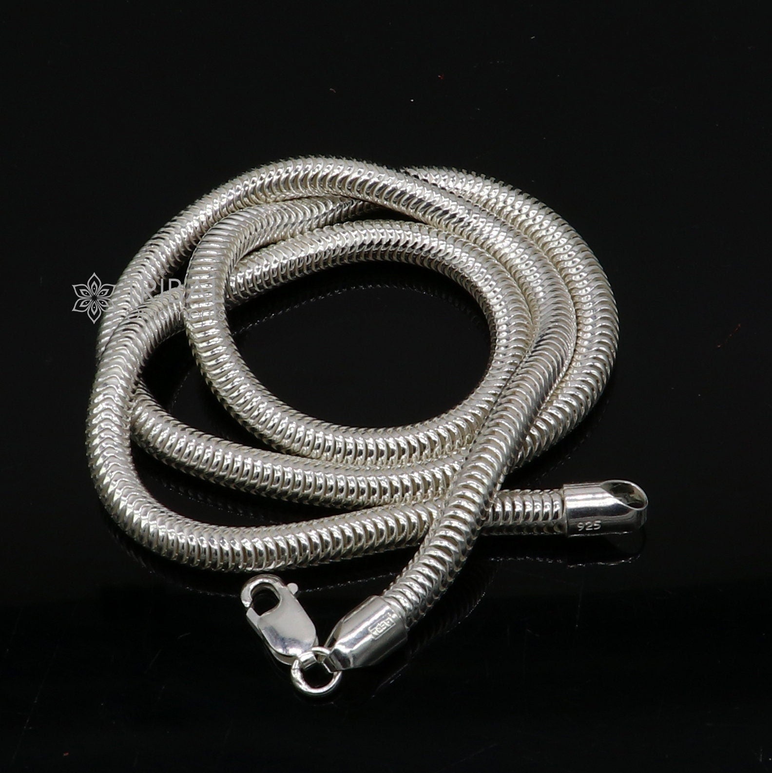 Sterling silver 20-inch 5mm smooth flexible snake chain necklace by Tribal Ornaments, showcasing its sleek, handmade design.