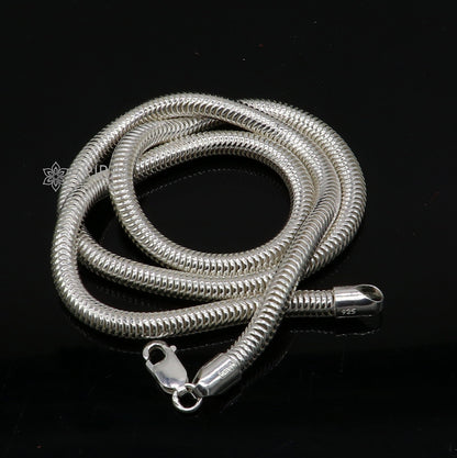 Sterling silver 20-inch 5mm smooth flexible snake chain necklace by Tribal Ornaments, showcasing its sleek, handmade design.