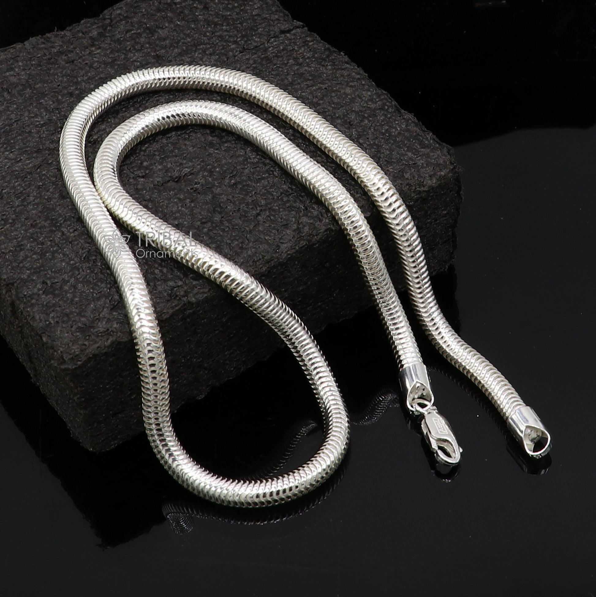 Sterling silver 20-inch 5mm smooth flexible snake chain necklace by Tribal Ornaments, showcasing its sleek, shiny design.
