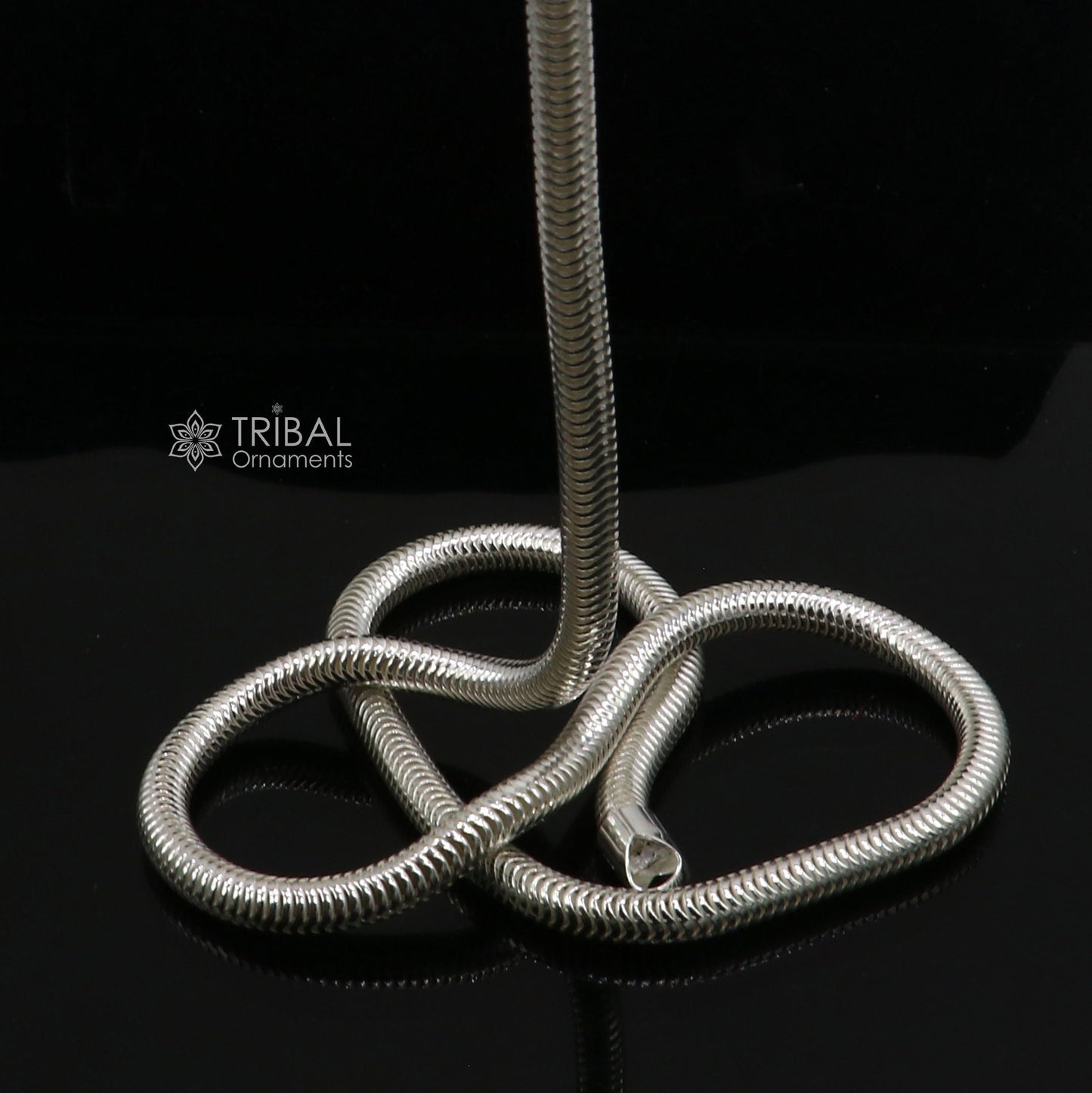 Sterling silver 20-inch 5mm smooth flexible snake chain necklace by Tribal Ornaments, showcasing its sleek, handmade design.
