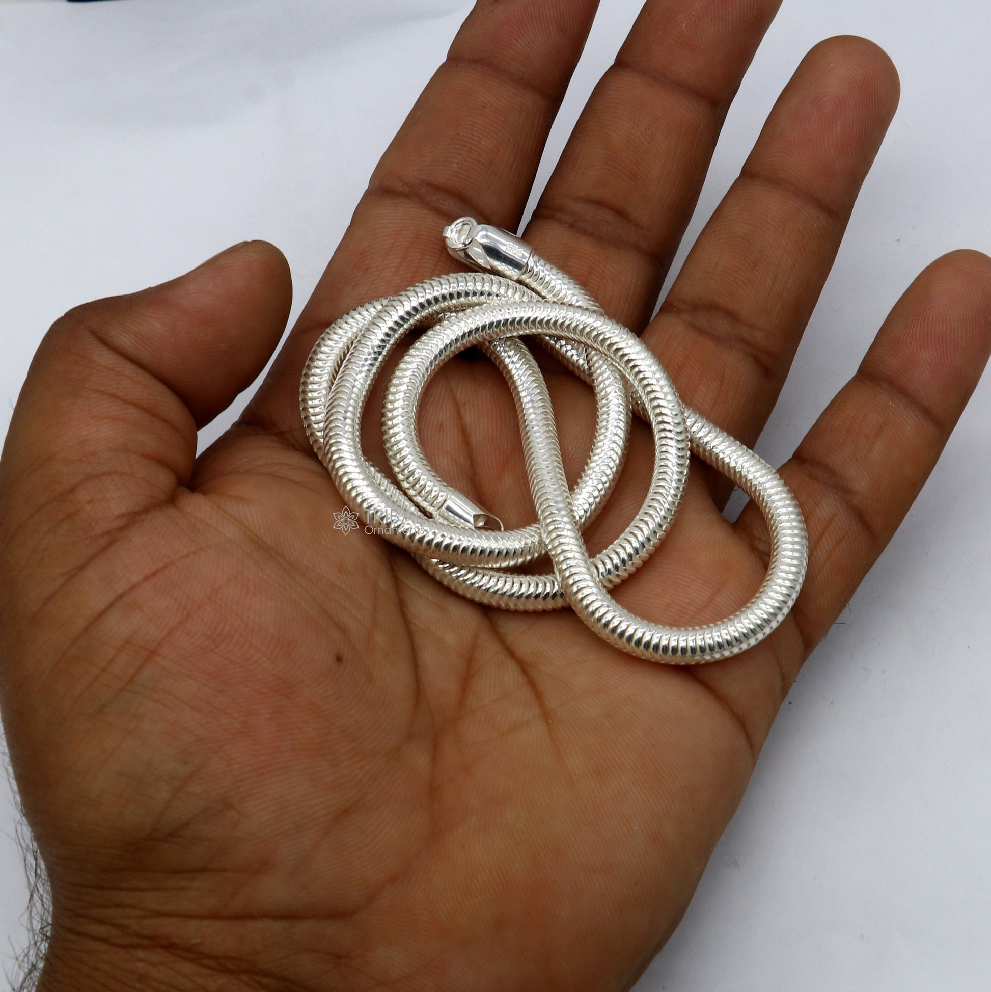 Sterling silver 20-inch 5mm smooth flexible snake chain necklace by Tribal Ornaments, showcasing its sleek, handcrafted design.