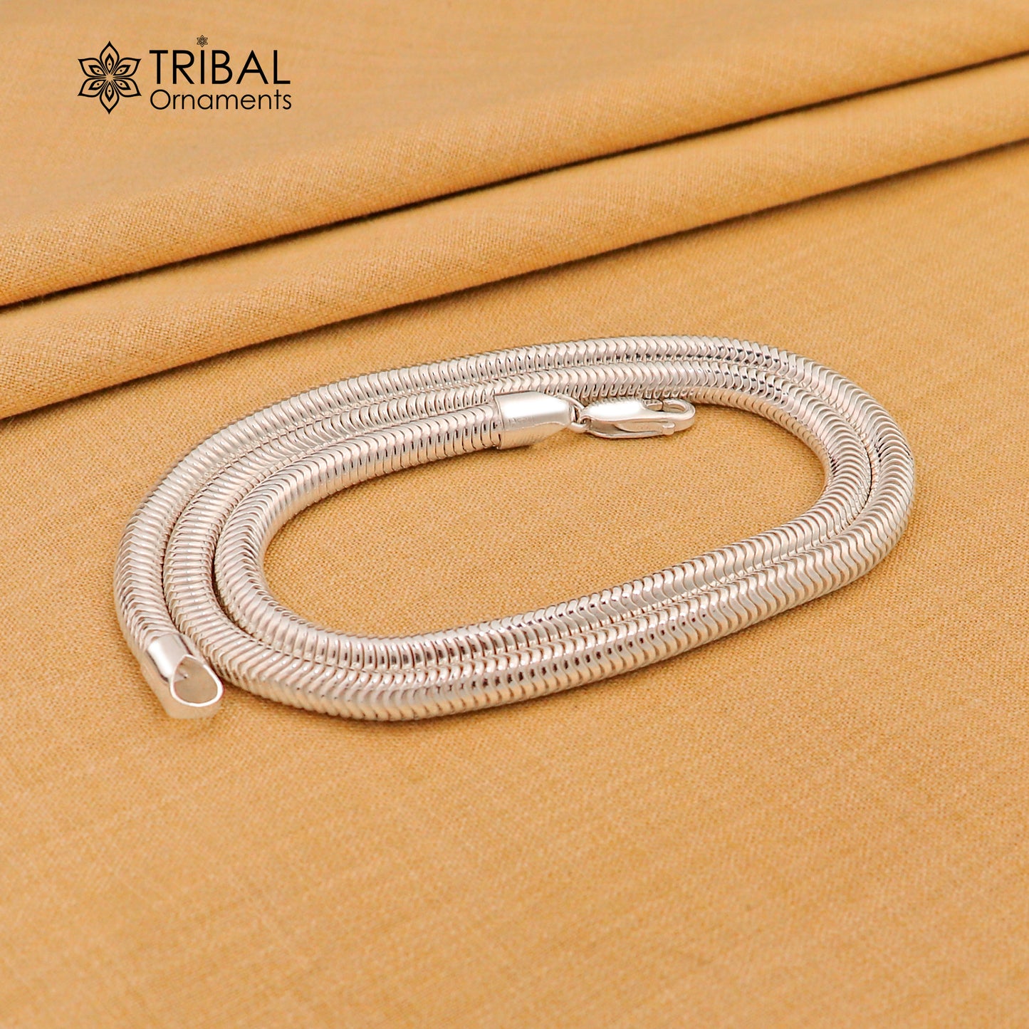 Sterling silver 20-inch 5mm smooth flexible snake chain necklace by Tribal Ornaments, showcasing its sleek, handmade design.