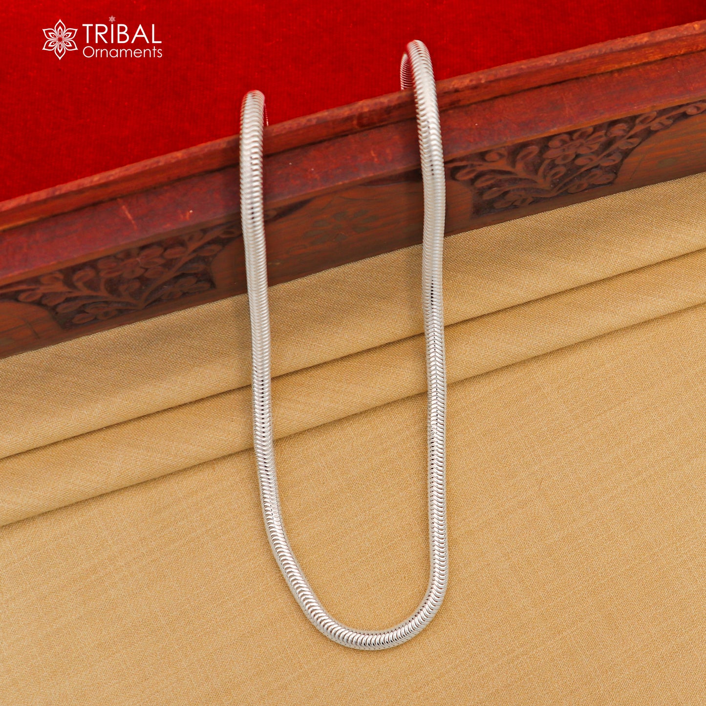 Sterling silver 20-inch 5mm smooth flexible snake chain necklace by Tribal Ornaments, showcasing its sleek, handmade design.