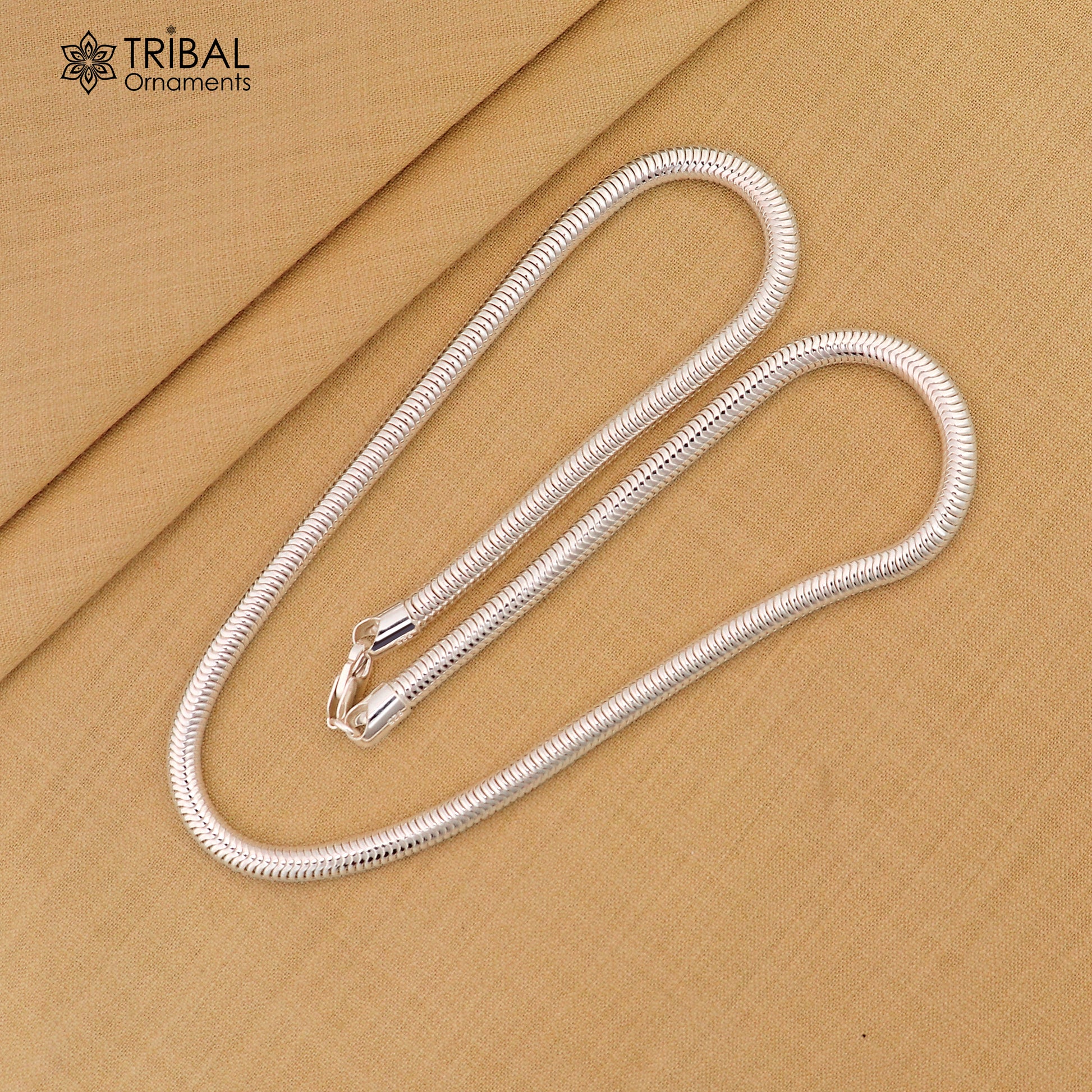 Sterling silver 20-inch 5mm smooth flexible snake chain necklace by Tribal Ornaments, showcasing its sleek, handmade design.
